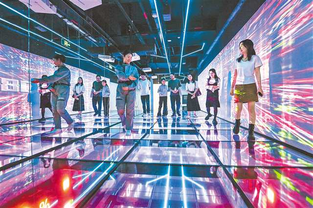 Visitors explored the futuristic charm of “Future Chongqing” at Jiefangbei in Yuzhong District on October 27