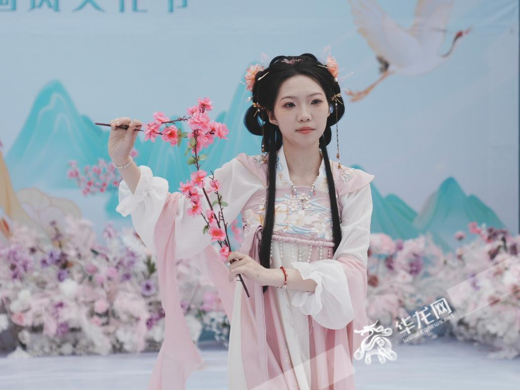 Student dressed up as one of the twelve flower goddesses performing