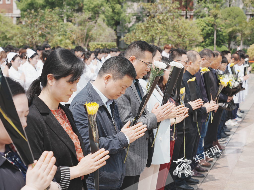 Teachers and students stood in silent tribute.