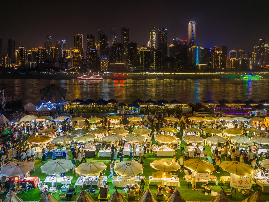 The night market on Nanbin Road springs to life under a starry sky, bustling with energy and activity