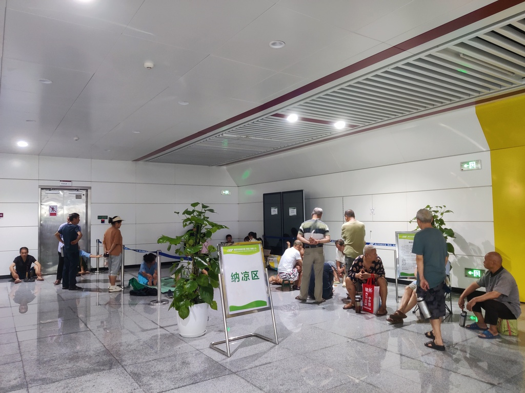 Citizens resting and enjoying the cool in a rail transit station