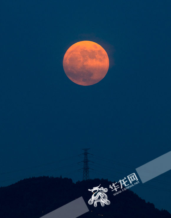 The full moon rises from Nanshan Mountain.