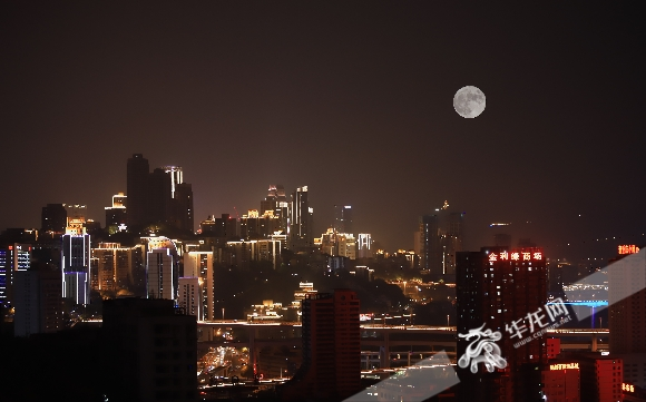 On 10th September, in Yuzhong District, a full moon hang in the sky. (double exposure)