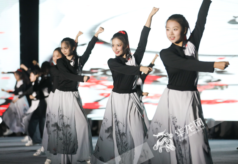 Students from Sichuan International Studies University performing on stage