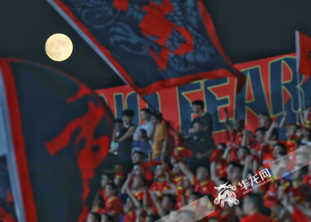 The full moon is high in the sky above Tonglianglong Stadium in Tongliang District, Chongqing.