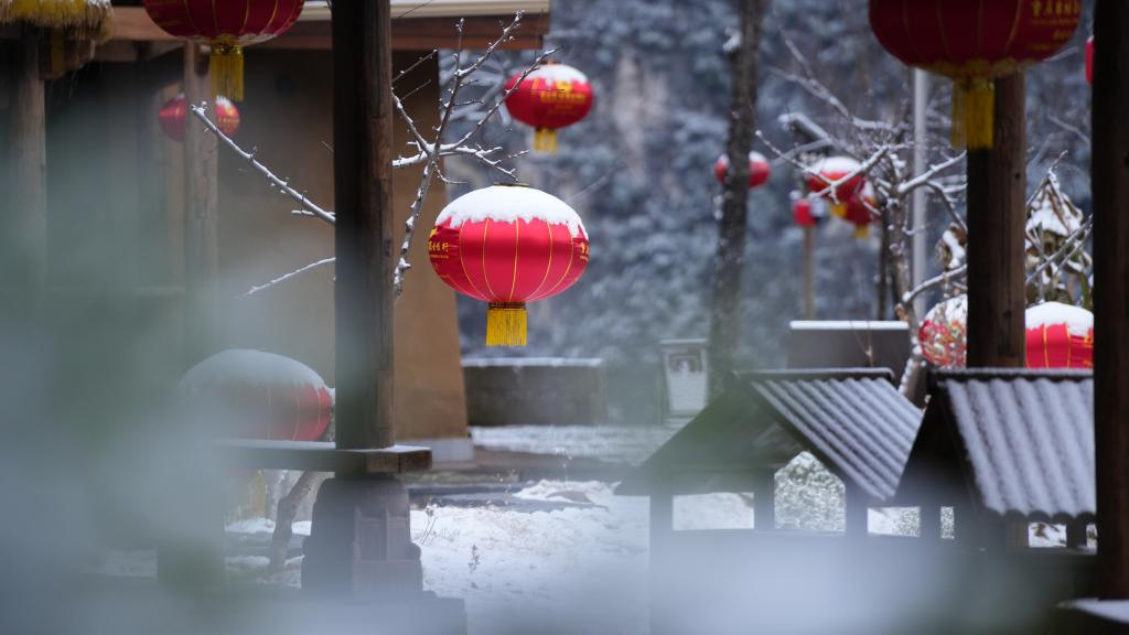 Red lanterns wearing white snow caps